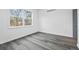 Well-lit bedroom with grey door and vinyl flooring at 550 Paines Nw Ave, Atlanta, GA 30318