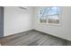 Bright bedroom with gray flooring and a large window at 550 Paines Nw Ave, Atlanta, GA 30318
