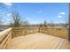 Wooden deck with railing offers a view of the treeline at 550 Paines Nw Ave, Atlanta, GA 30318