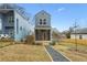 Gray two-story house with a front porch and walkway at 550 Paines Nw Ave, Atlanta, GA 30318
