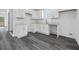 Modern kitchen with white cabinets and gray vinyl flooring at 550 Paines Nw Ave, Atlanta, GA 30318