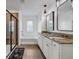 Modern bathroom with double vanity, soaking tub, and glass shower at 1087 Shadow Glen Dr, Fairburn, GA 30213