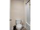 Bathroom with a toilet, tub, and shower at 1087 Shadow Glen Dr, Fairburn, GA 30213