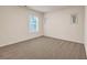 Simple bedroom with a window and neutral carpeting at 1087 Shadow Glen Dr, Fairburn, GA 30213