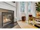 Elegant fireplace with modern design and surrounding seating at 1087 Shadow Glen Dr, Fairburn, GA 30213