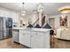 Modern kitchen island with white cabinets and a quartz countertop at 1087 Shadow Glen Dr, Fairburn, GA 30213