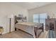 Cozy bedroom with double bed, dresser, and ample natural light at 11850 Markham Way, Hampton, GA 30228