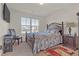 Spacious bedroom with a queen bed and ensuite bathroom at 11850 Markham Way, Hampton, GA 30228