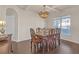 Elegant dining room with hardwood floors, chandelier, and table with seating for six at 11850 Markham Way, Hampton, GA 30228