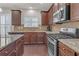 Kitchen with granite countertops and stainless steel appliances at 11850 Markham Way, Hampton, GA 30228