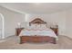 Main bedroom with large bed and nightstands at 11850 Markham Way, Hampton, GA 30228