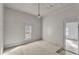 Empty bedroom with wood floors and white walls. Renovation potential at 119 E Johnson E St, Temple, GA 30179