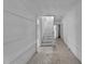 Long hallway with exposed wood and staircase at 119 E Johnson E St, Temple, GA 30179