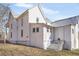 House exterior with white siding and metal roof at 119 E Johnson E St, Temple, GA 30179