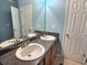 Bathroom with double vanity and granite countertop at 1734 Spring Hill Cv, Lithonia, GA 30058