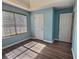 Bedroom with wood flooring and window at 1734 Spring Hill Cv, Lithonia, GA 30058