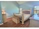 Main bedroom with light blue walls and large windows at 1734 Spring Hill Cv, Lithonia, GA 30058