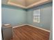 Bedroom with wood flooring and window at 1734 Spring Hill Cv, Lithonia, GA 30058