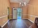 Dining room with hardwood floors and access to backyard at 1734 Spring Hill Cv, Lithonia, GA 30058