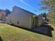 House exterior showing tan siding and patio at 1734 Spring Hill Cv, Lithonia, GA 30058