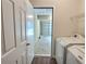 Laundry room with washer, dryer, and garage access at 1734 Spring Hill Cv, Lithonia, GA 30058