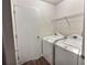 Laundry room with washer, dryer, and storage at 1734 Spring Hill Cv, Lithonia, GA 30058