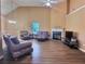 Living room with hardwood floors and a fireplace at 1734 Spring Hill Cv, Lithonia, GA 30058