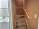 Carpeted staircase leading to upper level at 1734 Spring Hill Cv, Lithonia, GA 30058