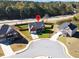 Aerial view of a house on a corner lot in a residential neighborhood at 799 Blue Juniper Cir, Loganville, GA 30052