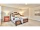 Spacious bedroom with wood bed frame and neutral decor at 799 Blue Juniper Cir, Loganville, GA 30052