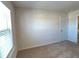 Bright bedroom with neutral walls and carpeted floor at 799 Blue Juniper Cir, Loganville, GA 30052