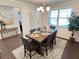 Spacious dining area with a farmhouse table and neutral decor at 799 Blue Juniper Cir, Loganville, GA 30052