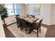 Elegant dining room featuring a large wooden table and comfortable seating at 799 Blue Juniper Cir, Loganville, GA 30052