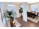 Open concept dining room and entryway with hardwood floors and decor at 799 Blue Juniper Cir, Loganville, GA 30052