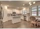 Modern kitchen with stainless steel appliances and white cabinets at 799 Blue Juniper Cir, Loganville, GA 30052