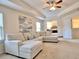 Spacious living area with sectional sofa, a view of the main bedroom, and a ceiling fan at 799 Blue Juniper Cir, Loganville, GA 30052