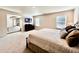 Large main bedroom with plush carpeting, a sitting area, and a view into another room at 799 Blue Juniper Cir, Loganville, GA 30052