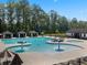 Resort-style pool with multiple areas for relaxation and fun at 799 Blue Juniper Cir, Loganville, GA 30052