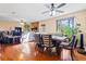 Open concept dining room with hardwood floors and living room view at 812 Bartow Ct, Riverdale, GA 30274