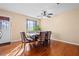 Dining room with hardwood floors and a ceiling fan at 812 Bartow Ct, Riverdale, GA 30274