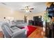 Bright living room with hardwood floors, a ceiling fan, and comfortable seating at 812 Bartow Ct, Riverdale, GA 30274