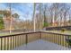 Backyard featuring a deck overlooking a large, green, fenced-in yard at 1692 Branch Creek Cv, Lawrenceville, GA 30043