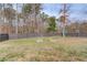 Backyard with a well-maintained lawn and fenced perimeter, ideal for outdoor activities at 1692 Branch Creek Cv, Lawrenceville, GA 30043