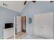 Bedroom with a vaulted ceiling, ceiling fan, closet, and bright windows at 1692 Branch Creek Cv, Lawrenceville, GA 30043