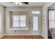 Cozy dining room featuring hardwood floors and an exterior door at 1692 Branch Creek Cv, Lawrenceville, GA 30043