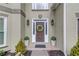 Close-up of the home's front door, showing the architectural details and complementary landscaping at 1692 Branch Creek Cv, Lawrenceville, GA 30043