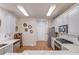 Kitchen with white cabinets, stainless appliances, and white countertops at 1692 Branch Creek Cv, Lawrenceville, GA 30043