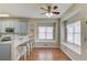 Eat-in kitchen featuring stainless appliances, hardwood floors, and lots of natural light at 1692 Branch Creek Cv, Lawrenceville, GA 30043