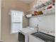 Laundry room featuring a washer, dryer, and shelving at 1692 Branch Creek Cv, Lawrenceville, GA 30043