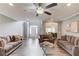 Bright living room featuring hardwood floors, neutral walls, and comfortable seating at 1692 Branch Creek Cv, Lawrenceville, GA 30043